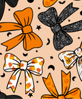 A repeating seamless pattern featuring various stylized bows in orange, black, and white with Halloween-themed patterns like spiderwebs, candy corn, and jack-o'-lanterns, set against a light peach background with small black stars and crescent moons.