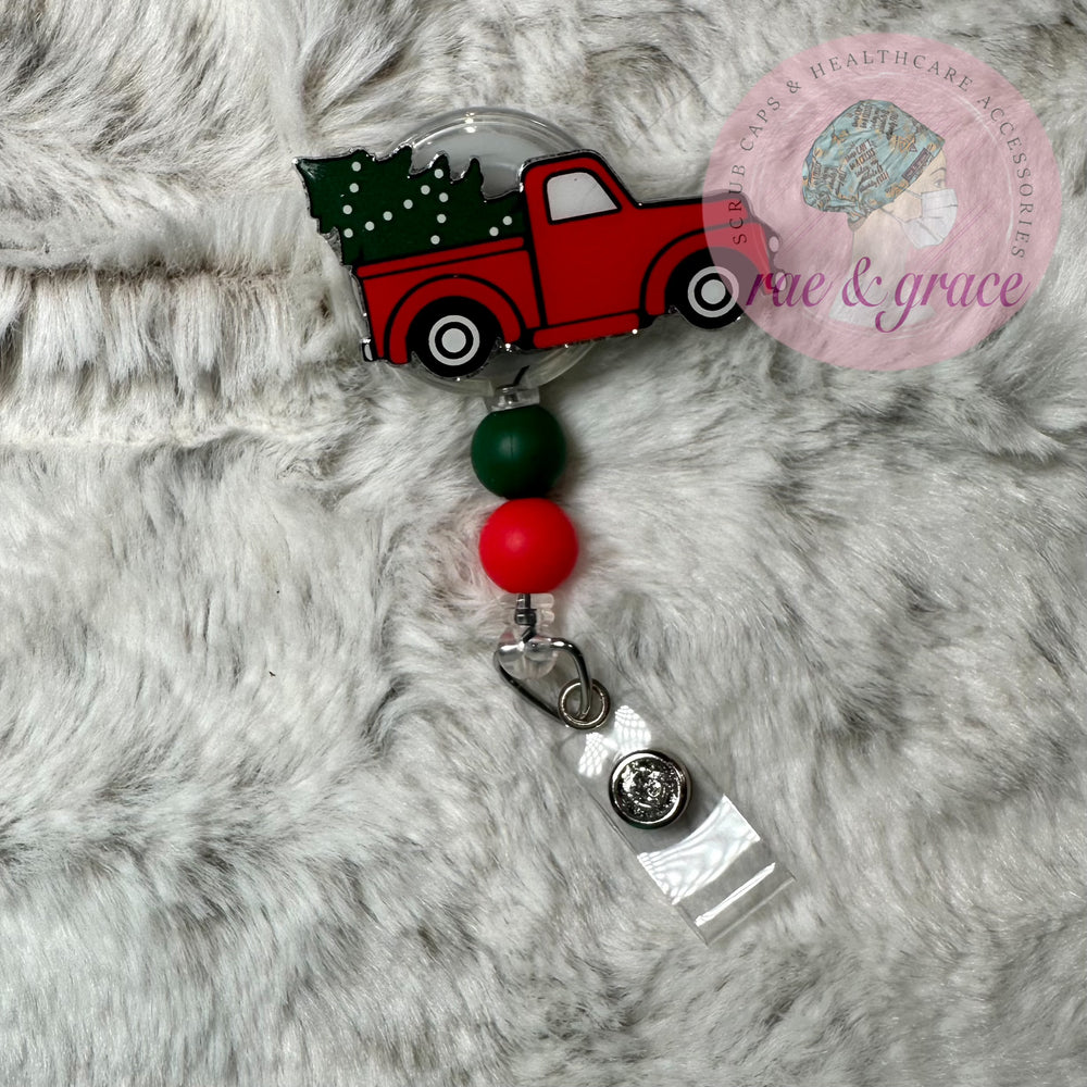 
            
                Load image into Gallery viewer, Truck w/ Christmas Tree - Badge Reel
            
        