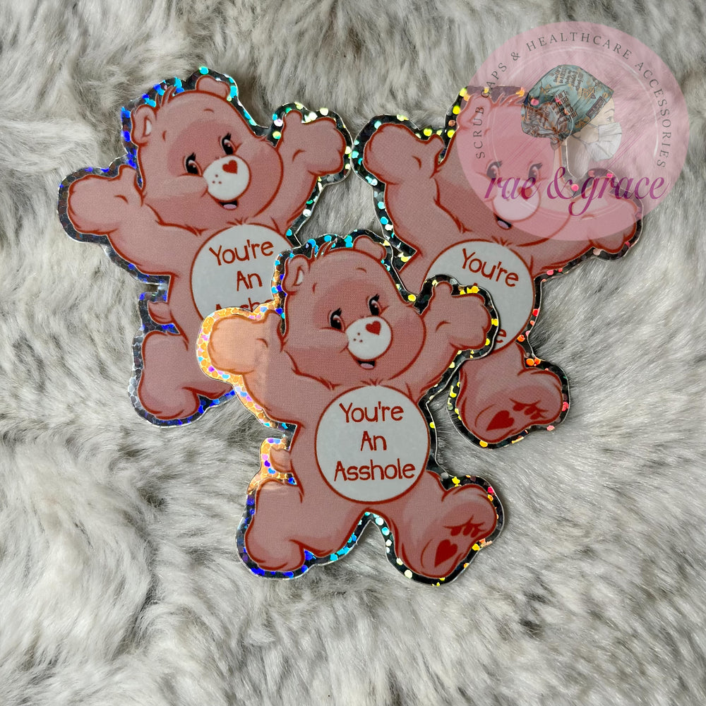 
            
                Load image into Gallery viewer, You&amp;#39;re An Asshole - Don&amp;#39;t Care Bear - Glitter Sticker
            
        