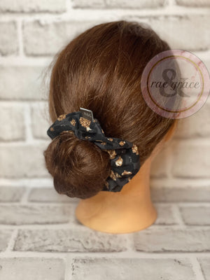 
            
                Load image into Gallery viewer, Black &amp;amp; Gold Leopard Scrunchie
            
        